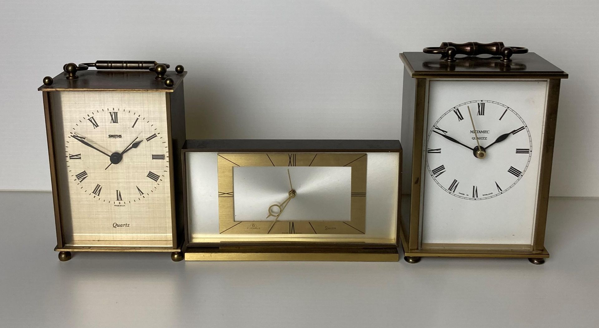 Three clocks including two carriage clocks by Smiths & Metamel and a Swiza 8 7 Jewels clock