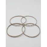 Four twisted, solid wire bracelets stamped 'STERLING', gross weight 48.