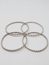 Four twisted, solid wire bracelets stamped 'STERLING', gross weight 48.