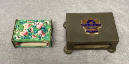 A vintage enamelled matchbox holder and a Tudric pewter matchbox holder with 'The Poultry Club,