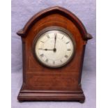 A Selfridge walnut cased mantel clock with inlay and arched top,