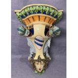 A vintage Majolica ceramic wall shelf/bracket with Medusa's head to bottom with sea serpents either