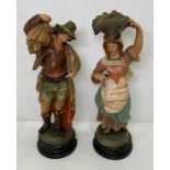 Two resin figurines of man and woman working, possibly Italian,