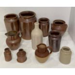 Eleven assorted glazed stoneware pottery items including jars, ink bottles, bottles,