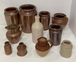 Eleven assorted glazed stoneware pottery items including jars, ink bottles, bottles,