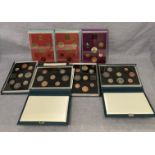 Seven assorted coin sets including 1983, two x 1984, 1985,