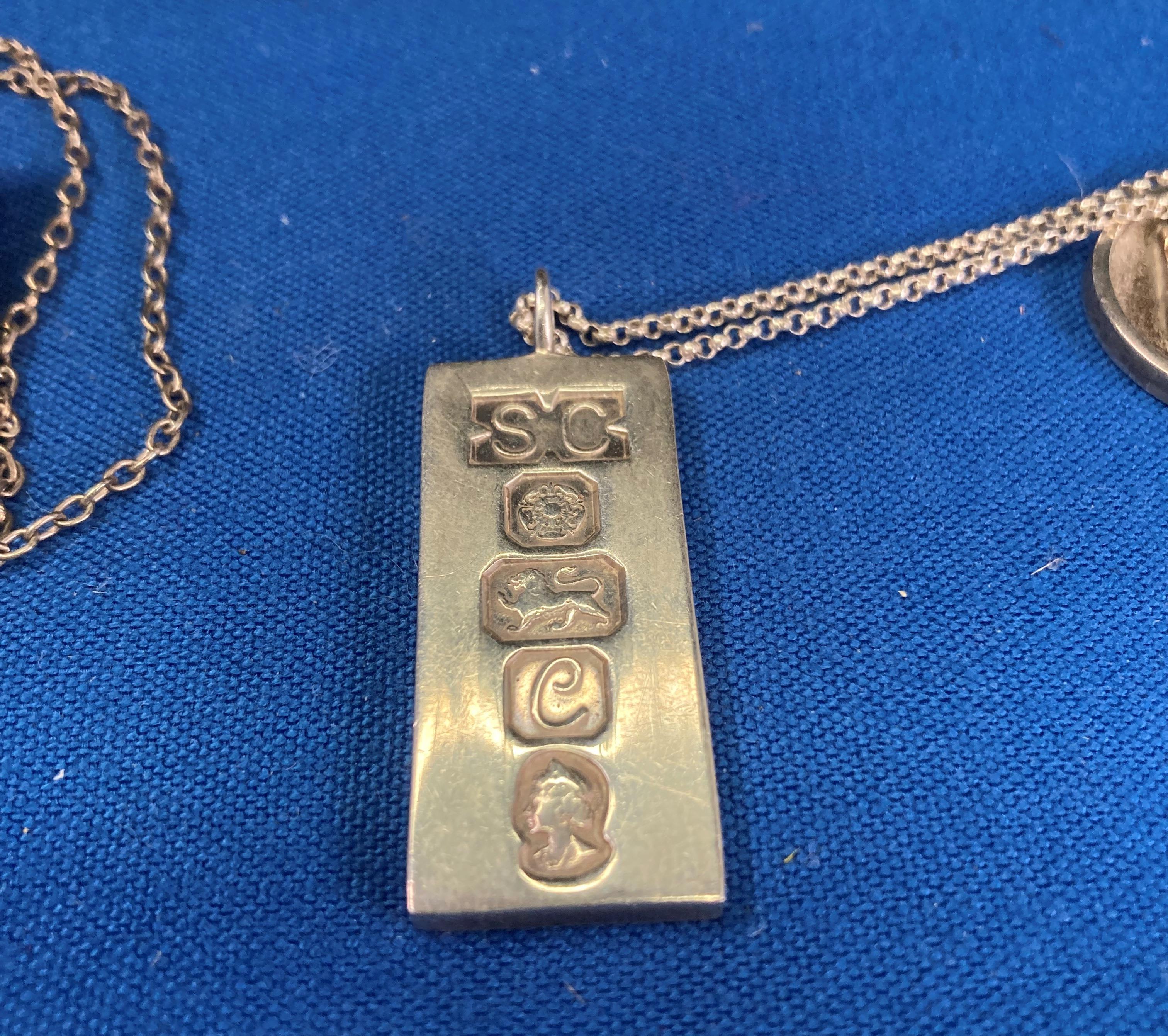 Four assorted silver (hallmark) chains and pendants including silver ingot, - Image 4 of 6