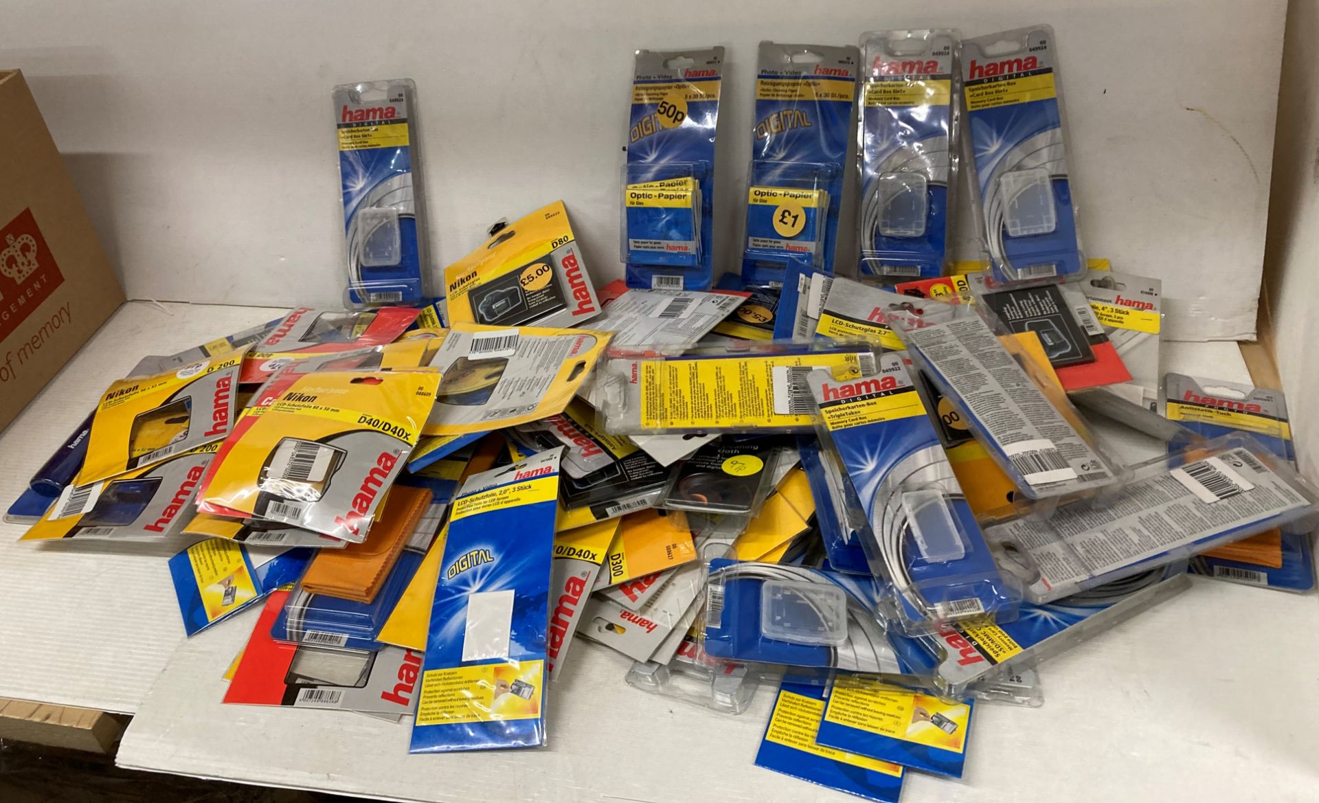 Large quantity of camera screen protectors, Optic paper, SD Card holders by Hama and Nikon,