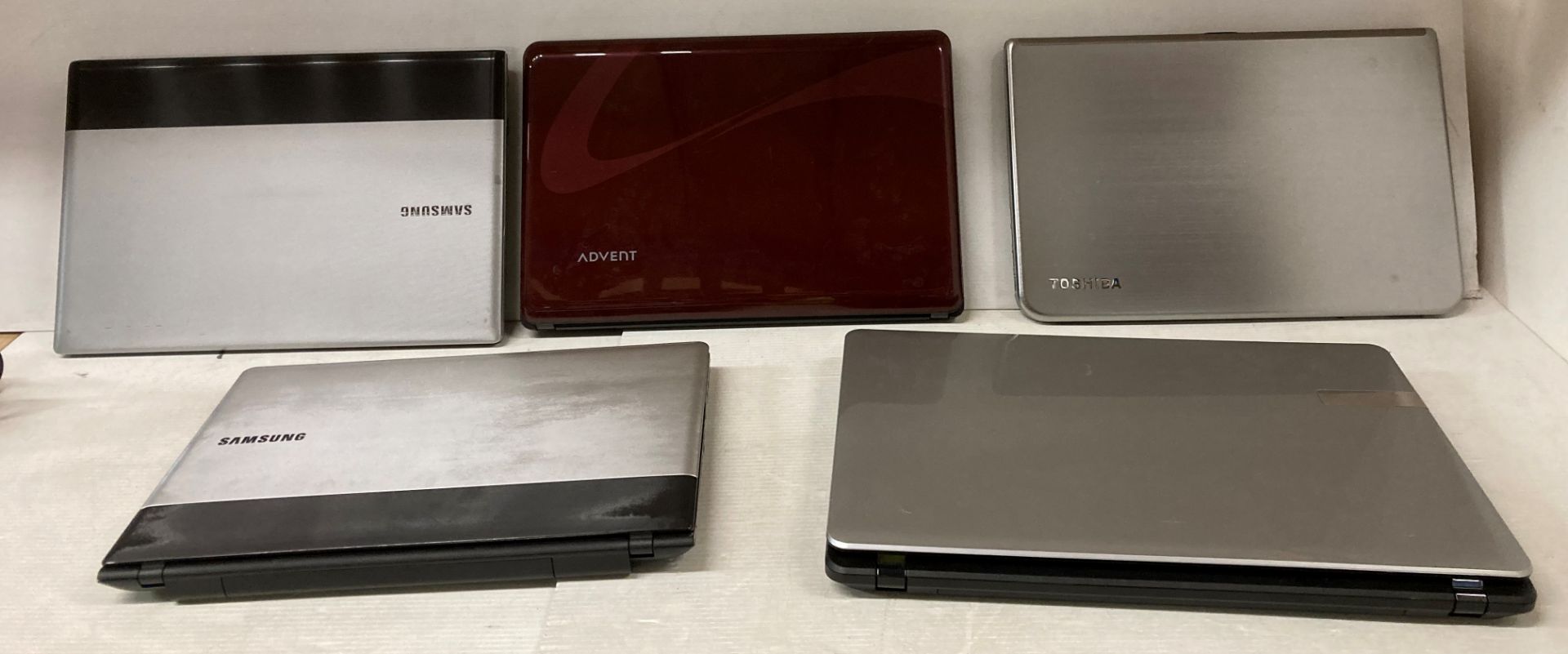 5 x assorted laptops (sold as seen) by Advent, Thosiba,