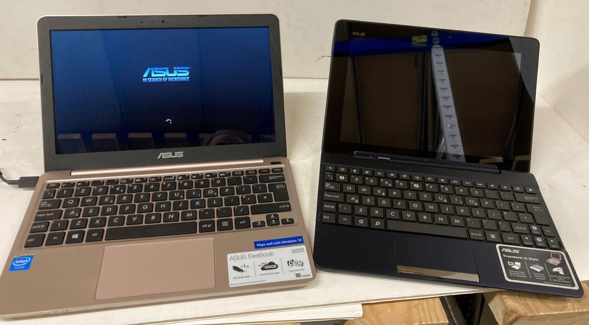 Asus Eeebook complete with power lead and a Asus TF300T tablet in blue (no power lead)