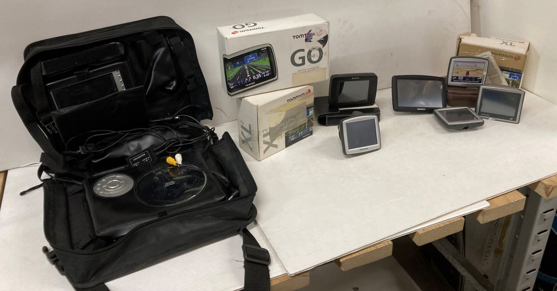 9 x TomTom and Navman sat navs complete with chargers and a Portable in-car DVD Player (saleroom