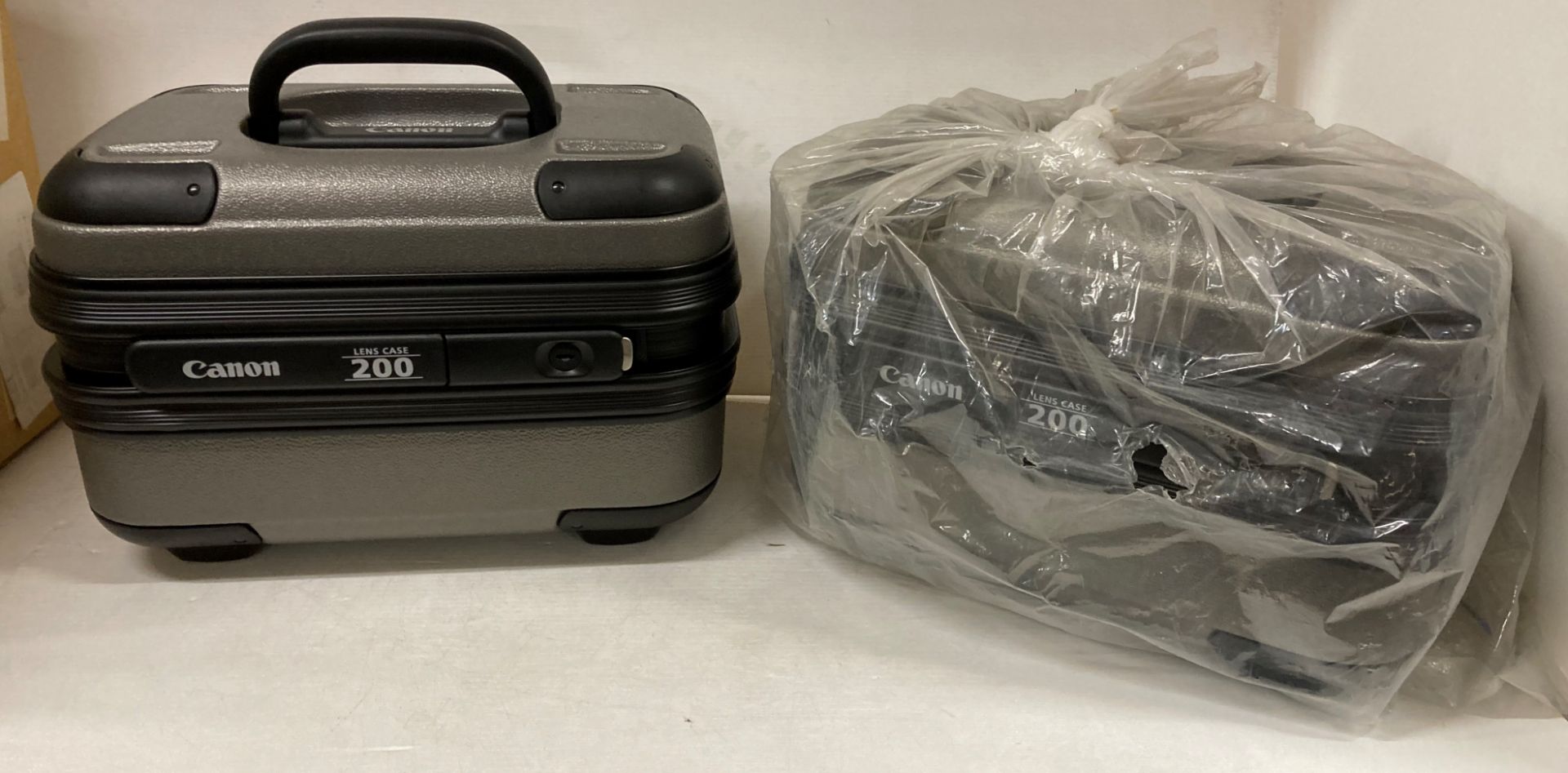 2 x Canon 200 Lens cases (boxed) (saleroom location: J112) Further Information