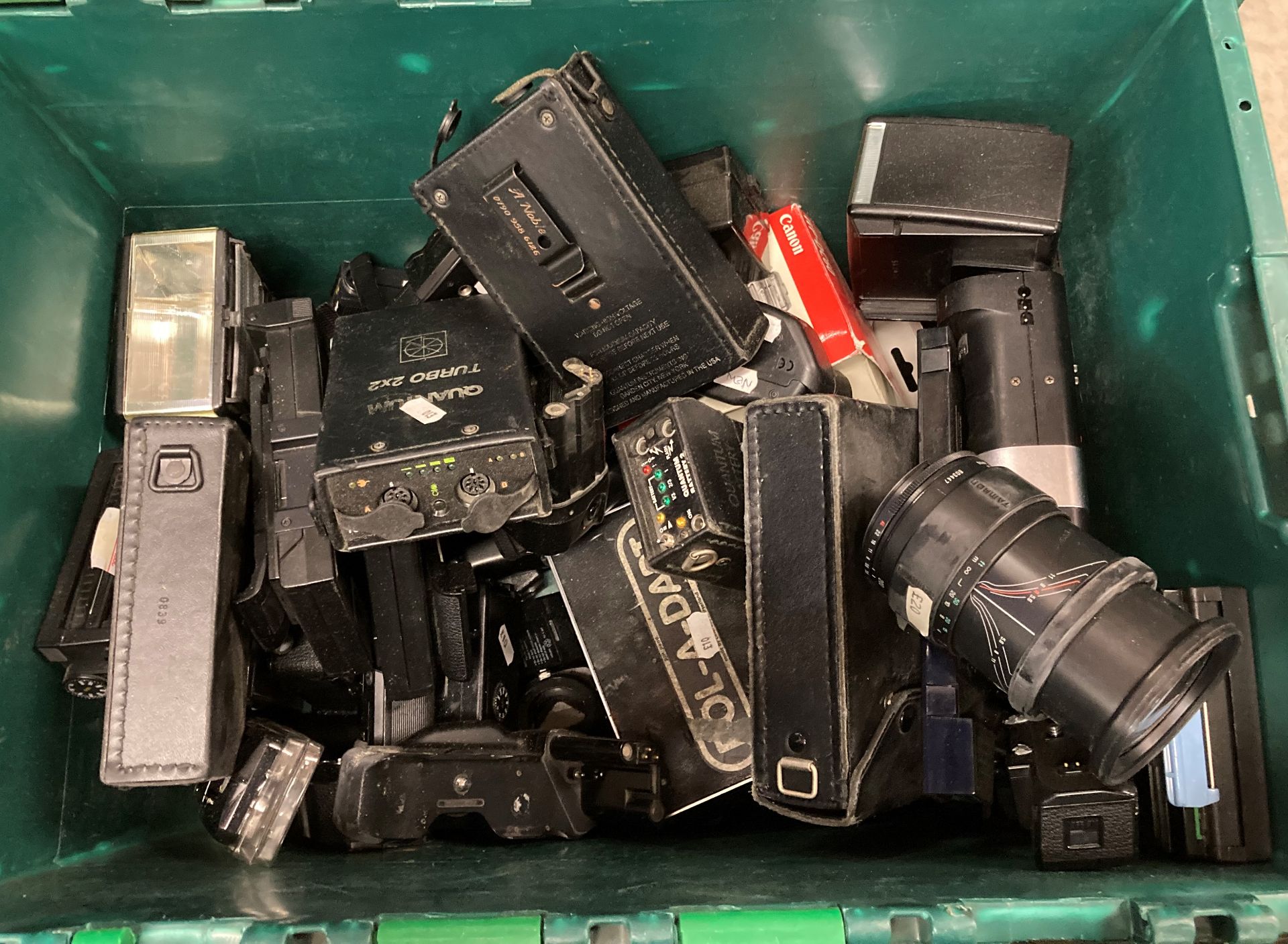 Contents to crate - Nikon MD-12 Batteries, Quantum turbo batteries, camera lenses, - Image 2 of 2