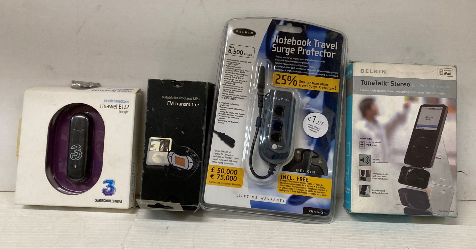 Contents to crate - mixed lot of FM Transmitters, notebook travel surge protectors,