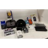 Contents to crate - assorted camera cases/bags, tablet cases, phone chargers,