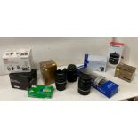 A mixed lot of camera accessories to include Lenses, 35mm Film, Sigma Fisheye, JVC marine case,