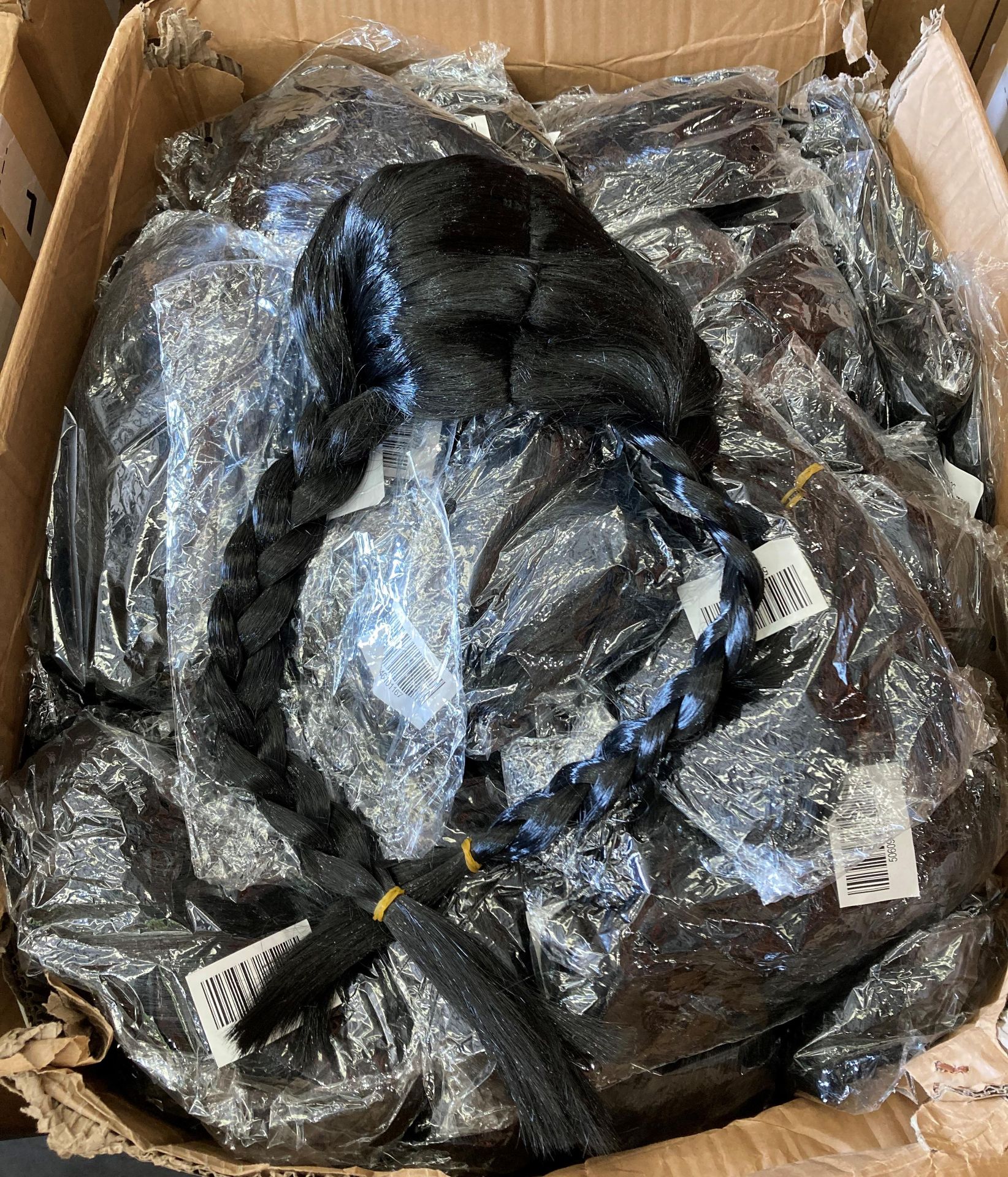 Box and contents - large quantity of Wednesday Addams black hair wigs (saleroom location: MA2)