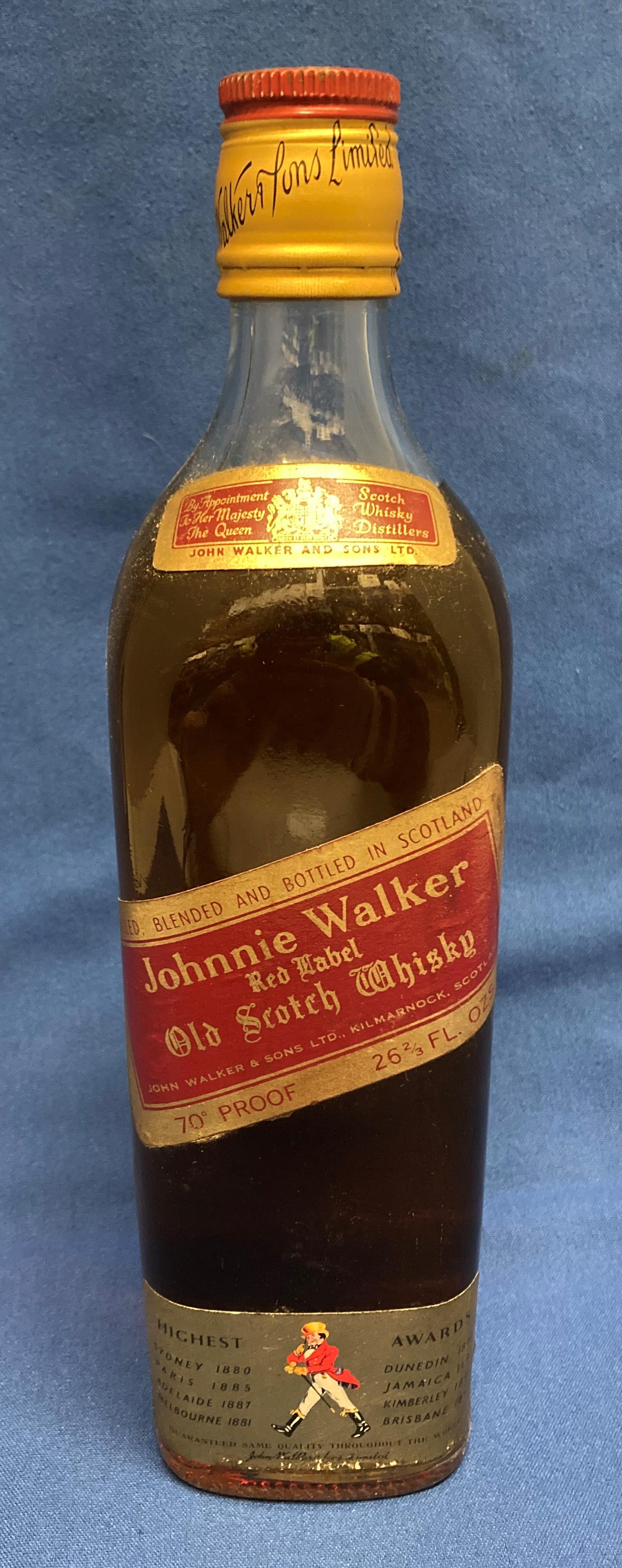 A Johnnie Walker Red Label Old Scotch Whisky, 70% proof 26 2/3 fl.