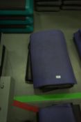 Four Black and One Purple Yoga Mats