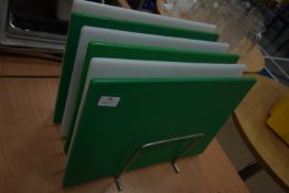 Three Green and Three White Chopping Boards on Stand