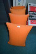 Four Orange Cushions