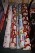 *Five Rolls of Christmas Wrapping Paper