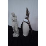 Penguin and a Figurine