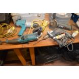 Four 110v Tools Including Bosch Angle Grinder, Dill, Makita Angle Grinder, and Drill