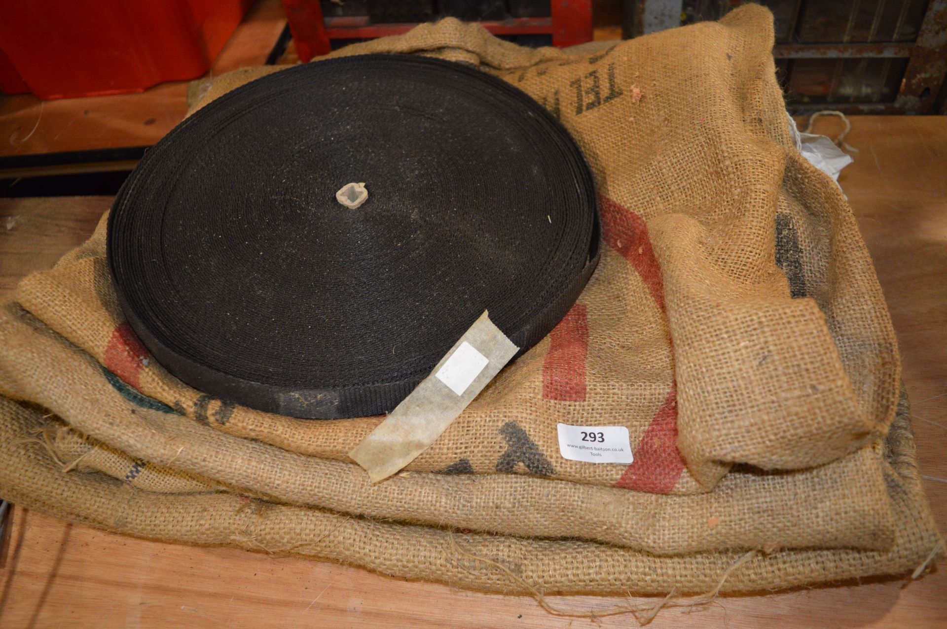 Eight Hessian Sacks and a Roll of Webbing