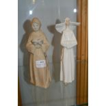 Two Spanish Figurines of a Monk and a Nun