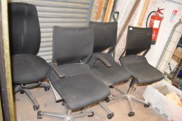 Four Black Swivel Office Chairs