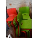 *Six Green and Eight Red Plastic Chairs