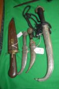 Three Eastern Kukris and a Knife with Carved Woode