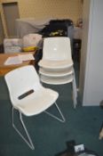 Four Stacking White Plastic Chairs (one AF)
