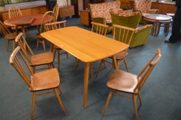 Ercol Dining Table and Six Matching Spindle Back C