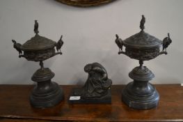 Two Metal Urns and a Sculpture of s Seated Nude
