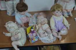 Four Porcelain Baby Dolls