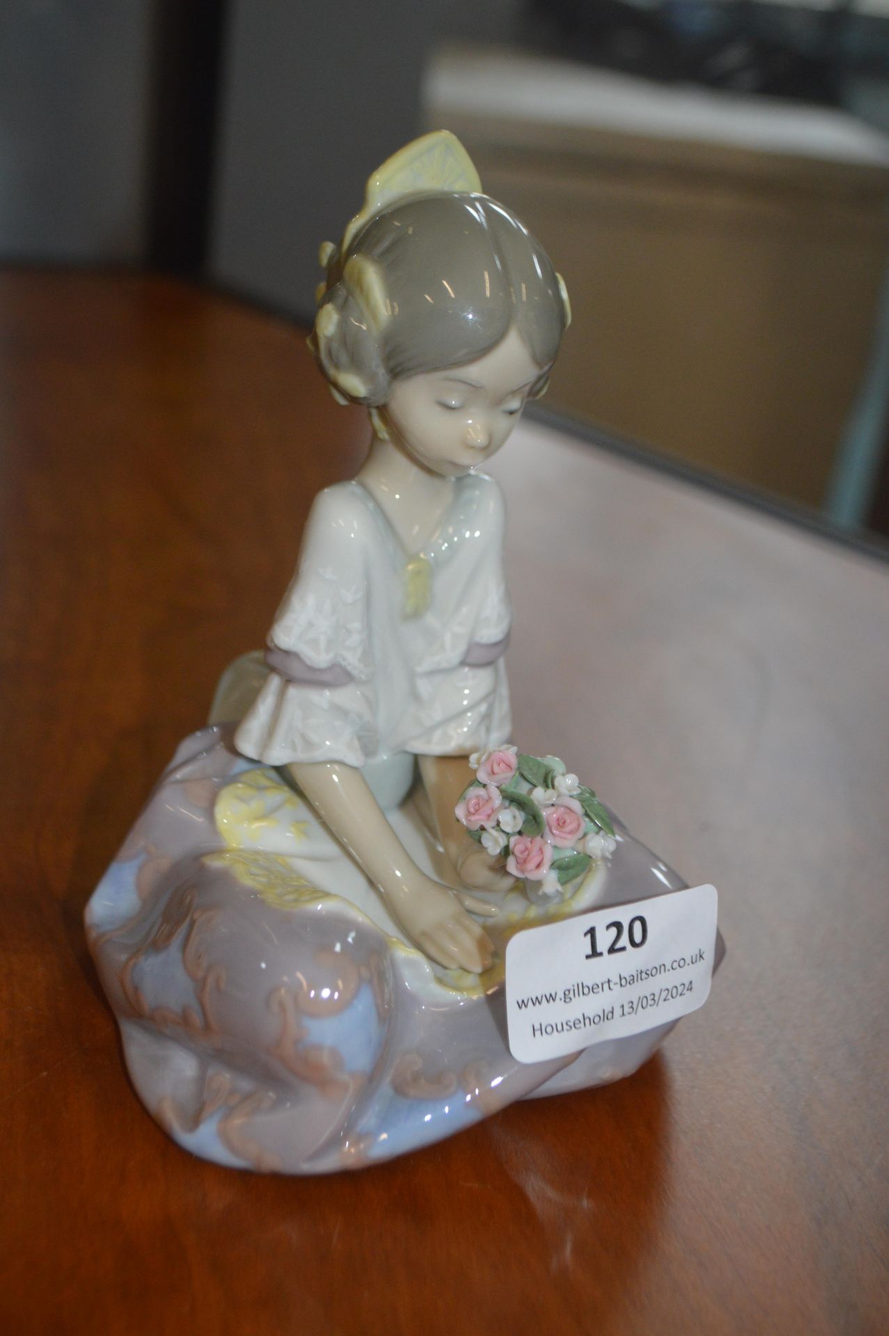 Lladro Figurine of a Seated Girl with Flowers