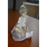 Lladro Figurine of a Seated Girl with Flowers