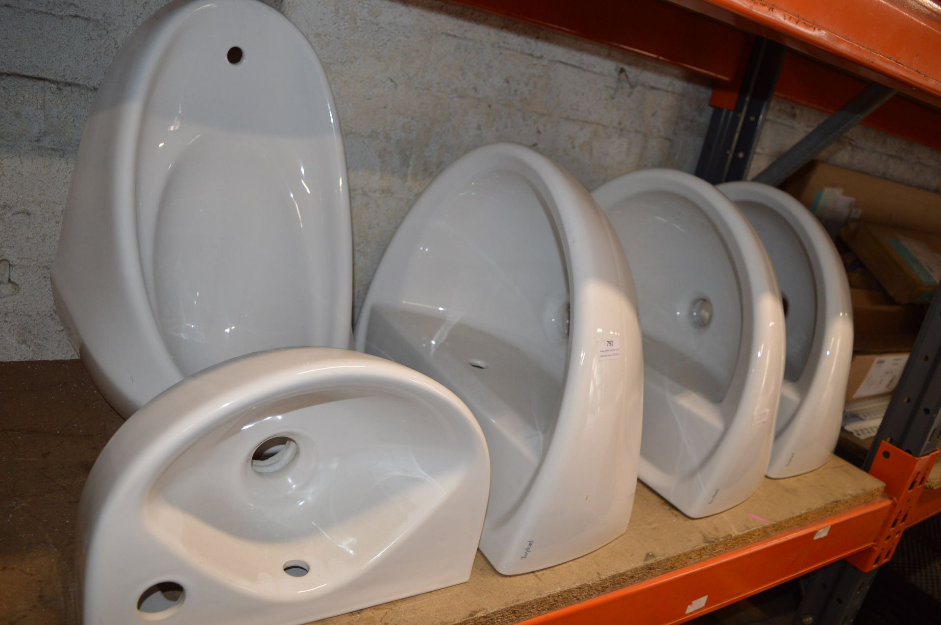 *Four White Ceramic Basins and One Urinal