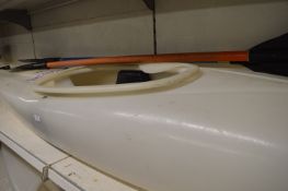 Clear Kayak with Two Oars