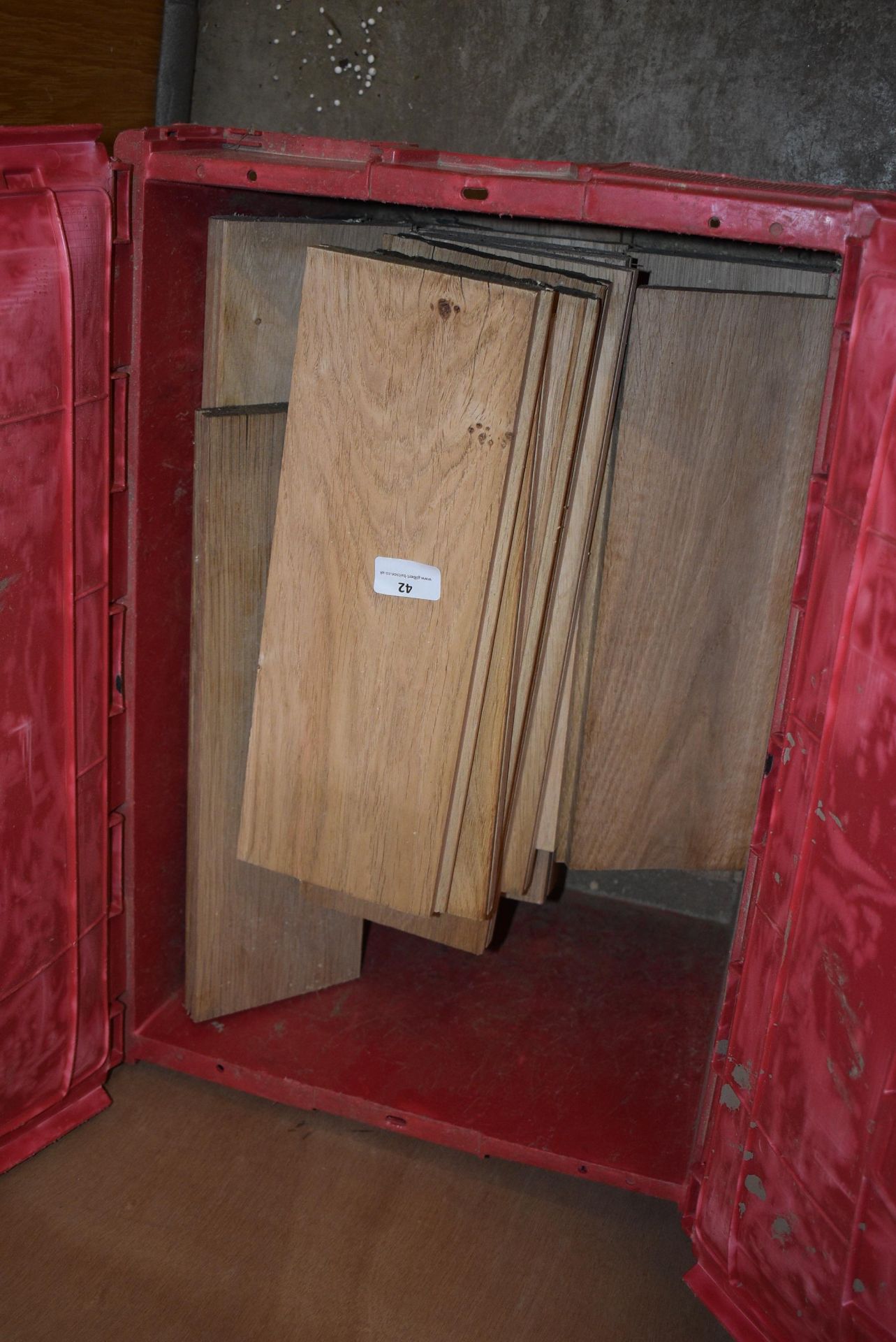*Plastic Storage Box Containing Oak Strip Flooring