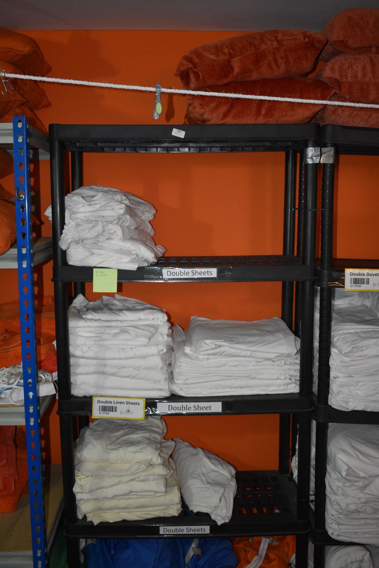 *Five Tier Plastic Shelf Unit Containing Linen Double Sheets