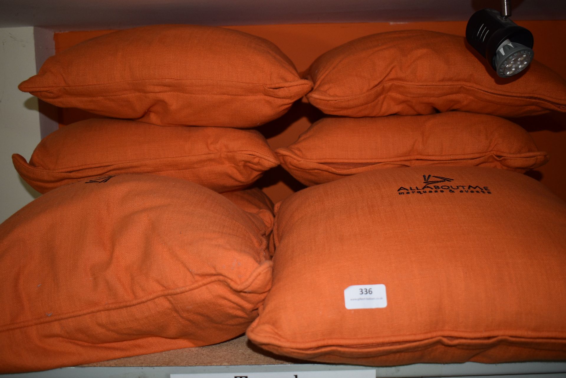 *Eight Orange Scatter Cushions
