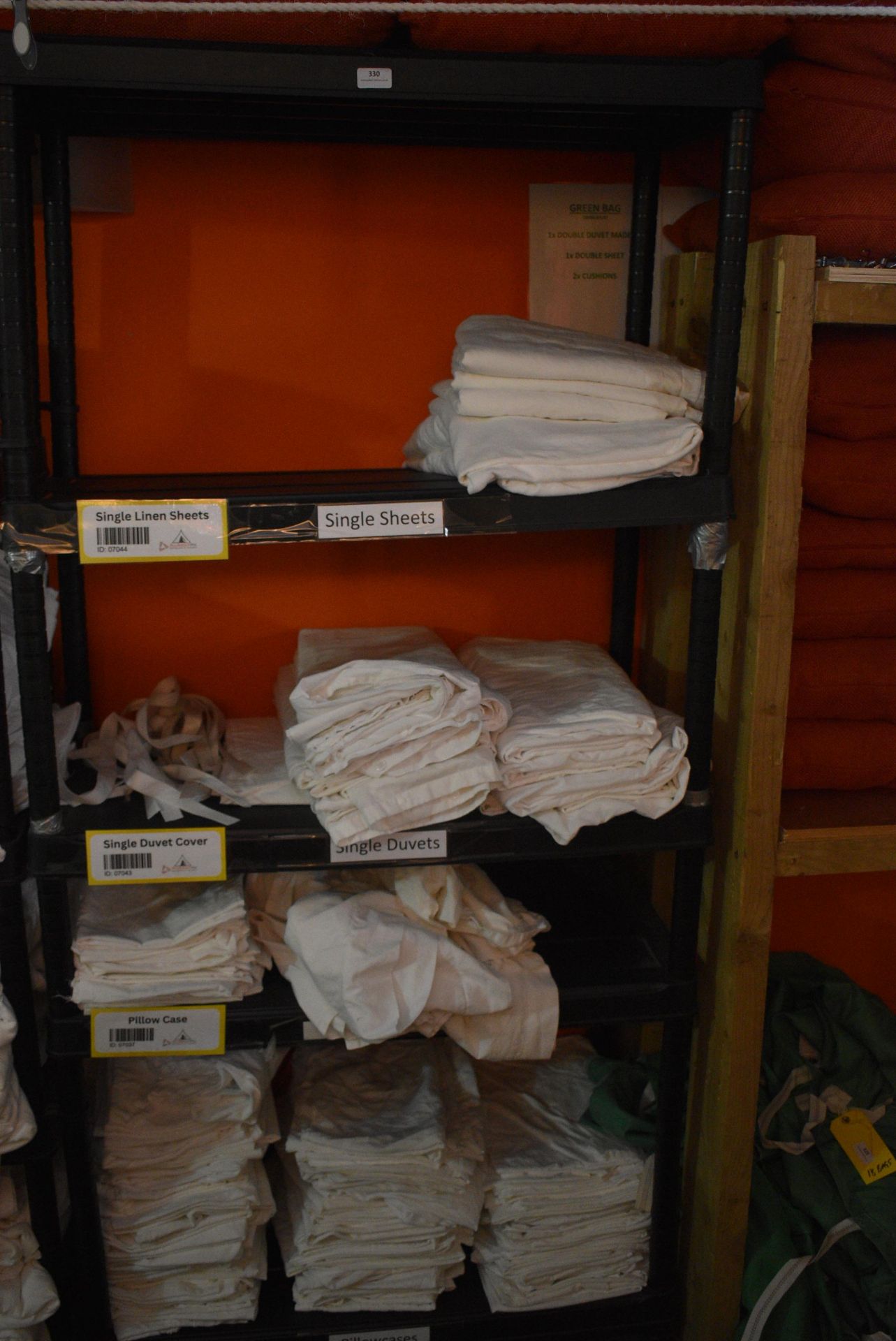 *Five Tier Plastic Shelf Unit Containing Single Duvets, Single Linen Sheets, Pillowcases, etc.