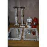 *Pair of Ornate Candlesticks, Two Decorative Hurricane Lamps, and a Pair of Metal Framed Mirrors
