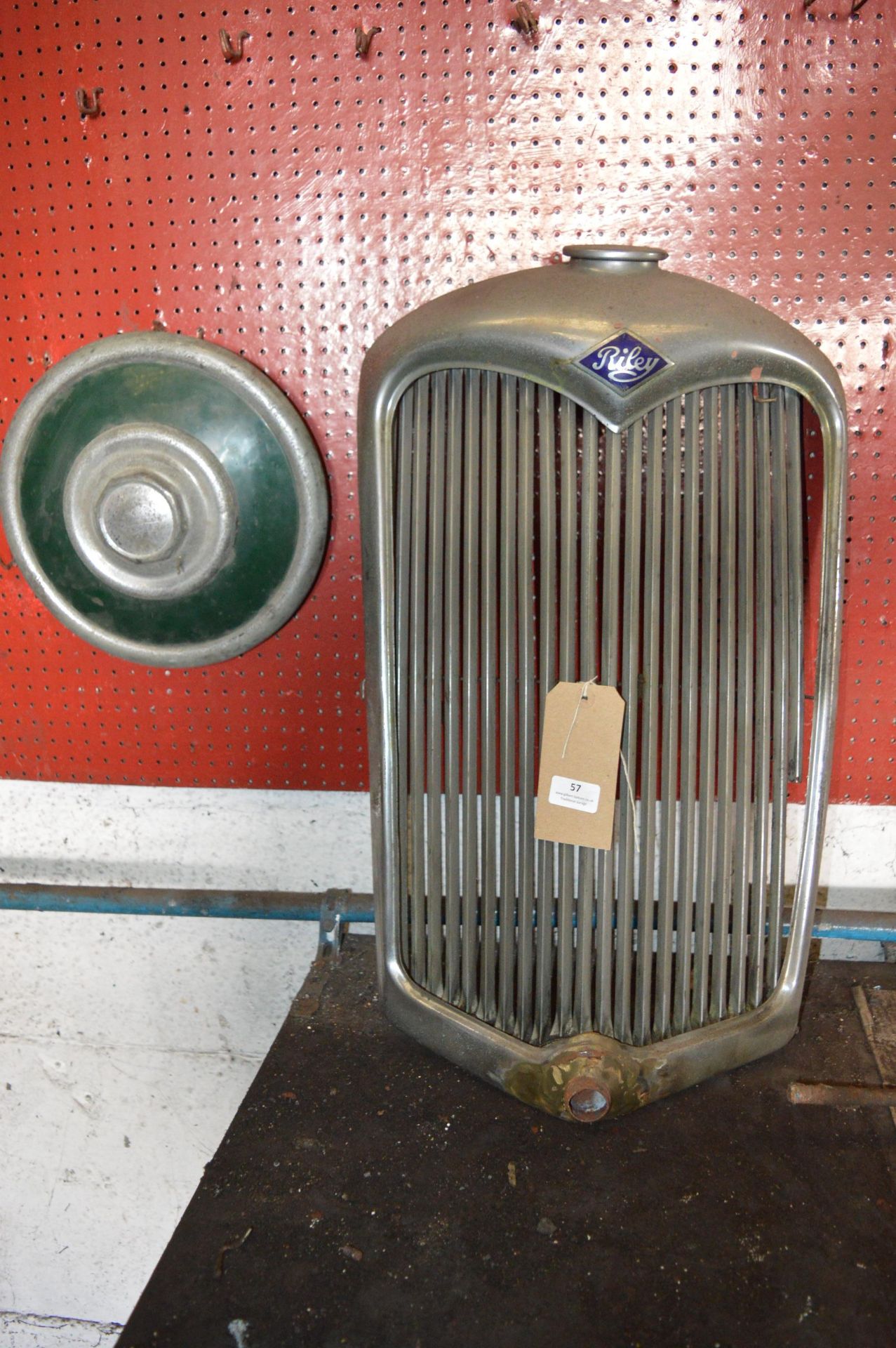 Old Riley Radiator Grill for Display and a Retro Vehicle Hub Cap