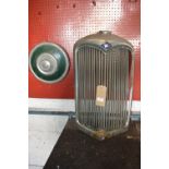 Old Riley Radiator Grill for Display and a Retro Vehicle Hub Cap