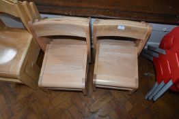 *Seven Stackable Beech Child’s Chairs