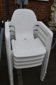 Four White Stacking Garden Chairs